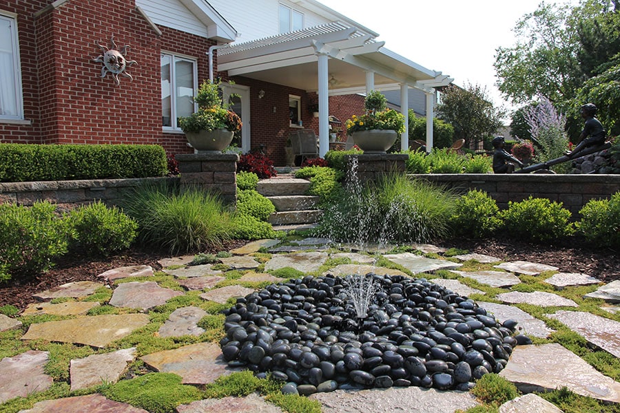 paver patio with water features shooting water in dupage county illinois