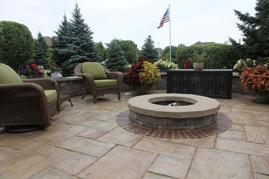 paver stone patio and firepit with retaining wall seating