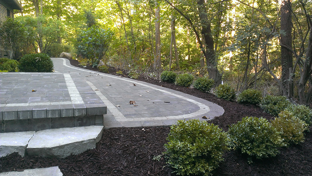 brick driveway with fancy design done by bret-mar landscaping