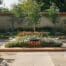 an elegantly arranged garden layout, featuring a harmonious blend of geometric flower beds, carefully placed pathways, and thoughtfully designed seating areas, showcased in a contemporary urban landscape.