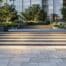 a modern urban landscape showcases innovative eco-friendly hardscape materials, featuring sleek paving stones and stylish concrete installations that highlight the latest sustainable trends in outdoor design.